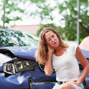 Injured woman holding neck after accident, highlighting documenting injuries after an accident